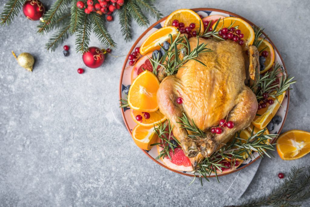 Roasted chicken or turkey. Traditional festive food for Christmas or Thanksgiving. Christmas Dinner