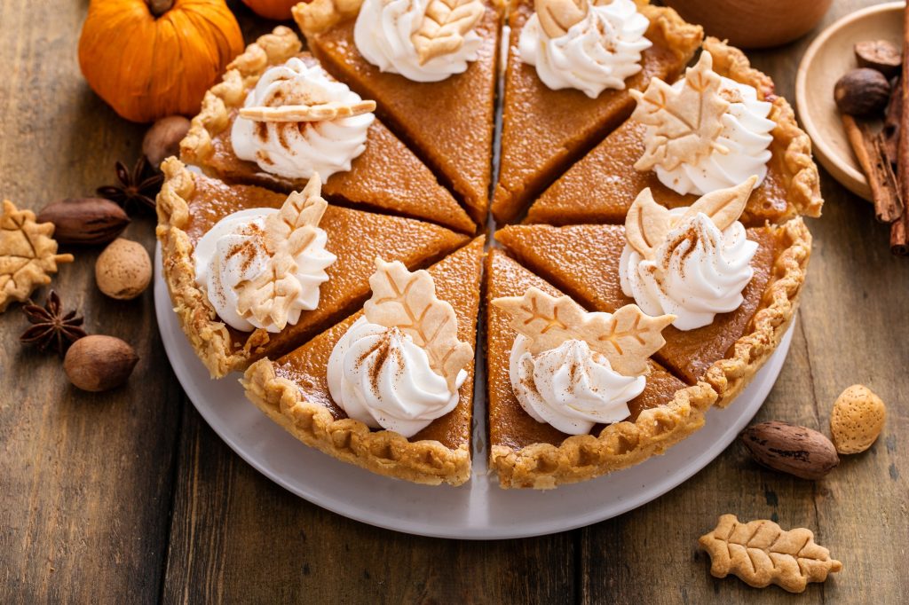 Traditional Thanksgiving pumpkin pie cut into slices